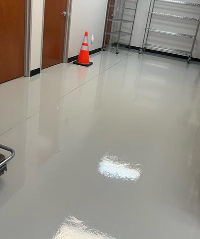 A glossy, freshly cleaned commercial hallway floor.