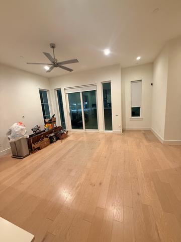 An empty living room partway through a cleaning.