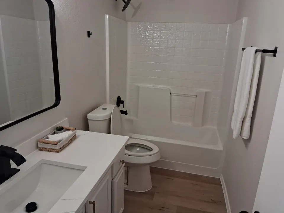 Clean bathroom with tub and towel after a move-in cleaning