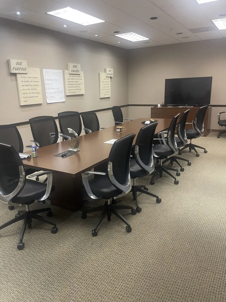 Clean office conference room with long table and chairs after a commercial cleaning