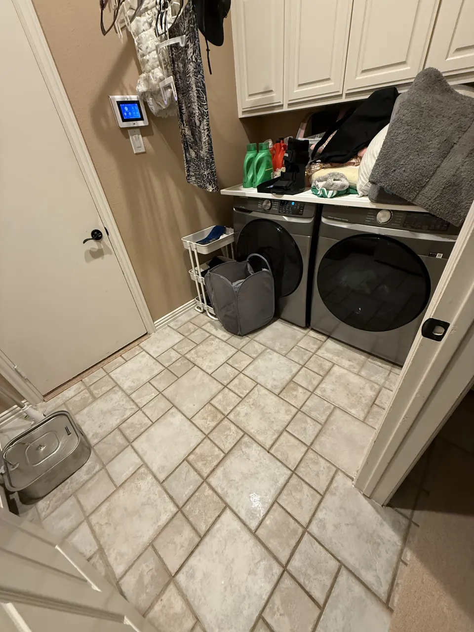 Home laundry room with washer and dryer during a residential cleaning
