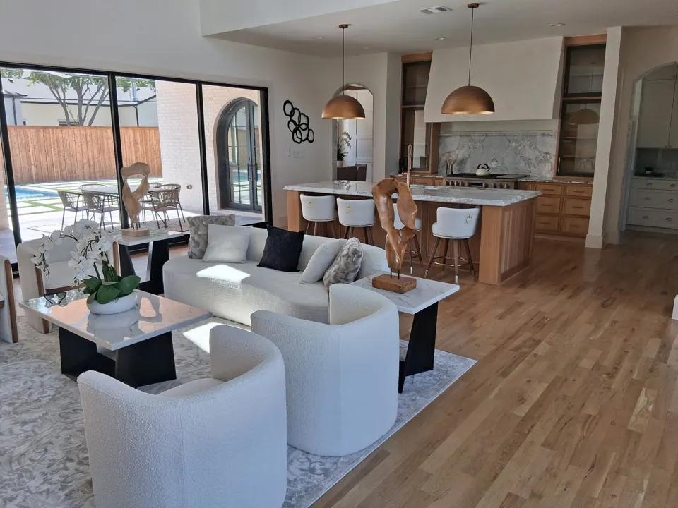 Spotless open-concept living room and kitchen after a Famous Pink Cleaning residential clean